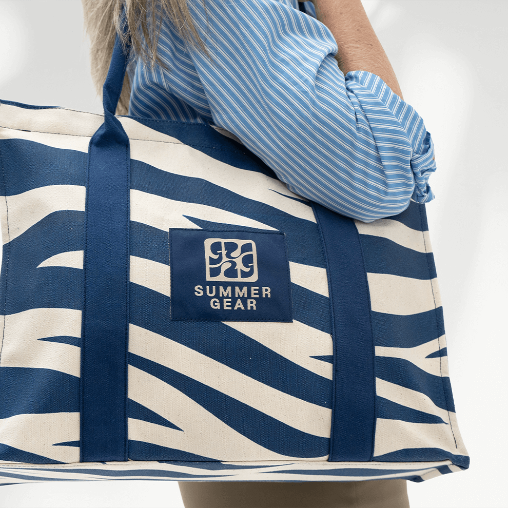 Onda blauwe shopper met ritssluiting en stevige handvatten voor dagelijks gebruik