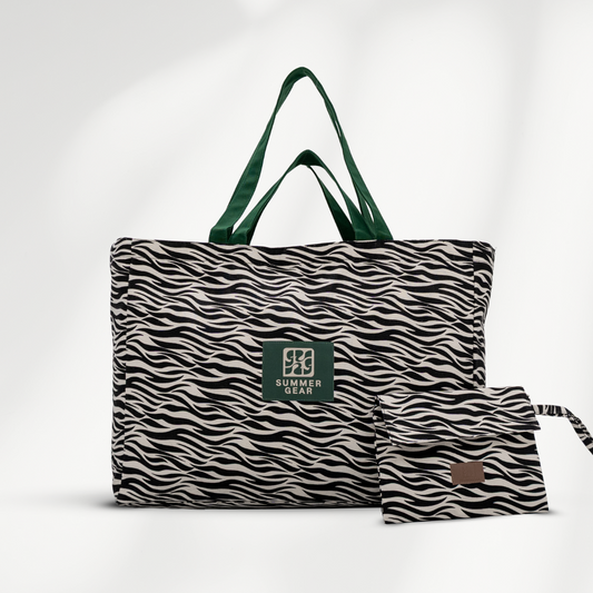 Grote strandtas Savan XL met 2 handvaten die volledig afsuit met rits van  canvas in de zeebraprint en gratis clutch