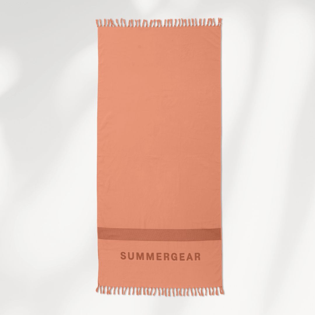 Roze hamamdoek van biologisch katoen van SummerGear volledig uitgerold in studio